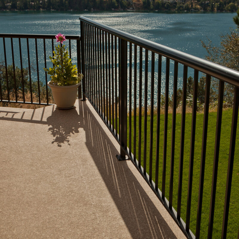 Lake view from a vinyl deck with Round Top Black Picket Deck Railing
