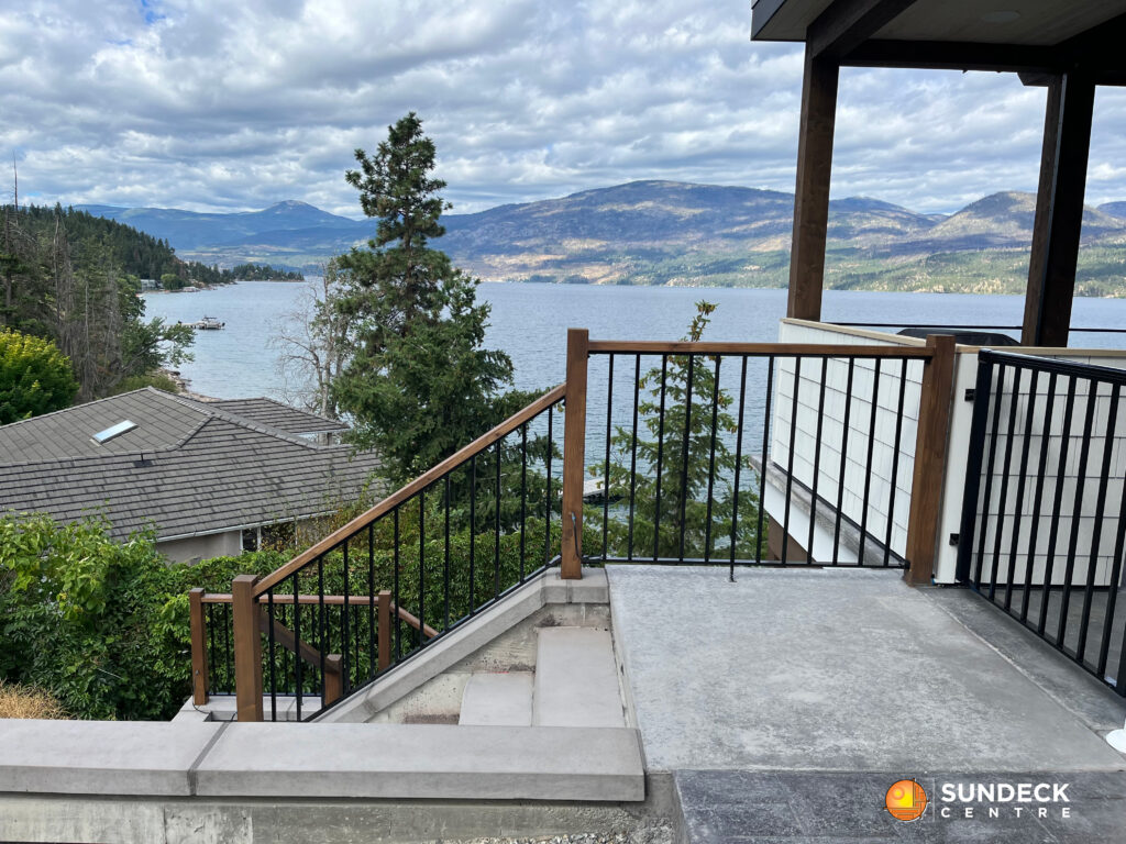 Sundeck overlooking a lake with Infill Picket Panel Installation, Vernon BC